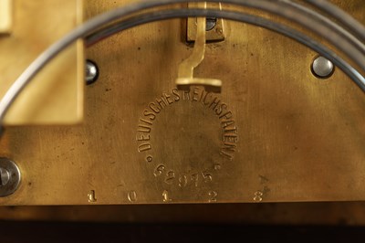 Lot 864 - A LATE 19TH CENTURY GERMAN OAK CASED MANTEL CLOCK