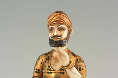 Lot 164 - A RARE 19TH CENTURY INDIAN CARVED IVORY AND GILDED FIGURE