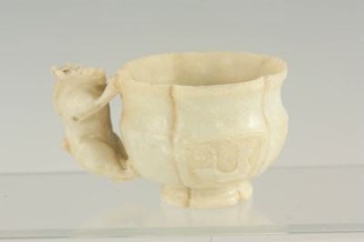 Lot 242 - A CHINESE ARCHAISTIC JADE CUP