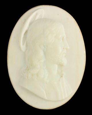 Lot 131 - AN EARLY CARVED OPAQUE GLASS OVAL PORTRAIT OF CHRIST
