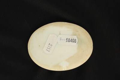 Lot 131 - AN EARLY CARVED OPAQUE GLASS OVAL PORTRAIT OF CHRIST