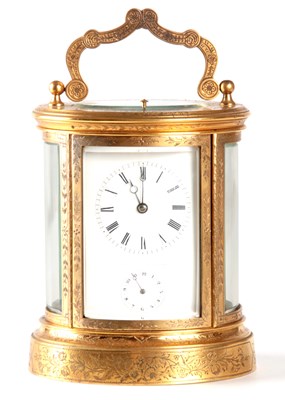 Lot 815 - JAPY FRERES AND CO. A 19TH CENTURY ENGRAVED GILT OVAL CASED REPEATING FRENCH CARRIAGE CLOCK