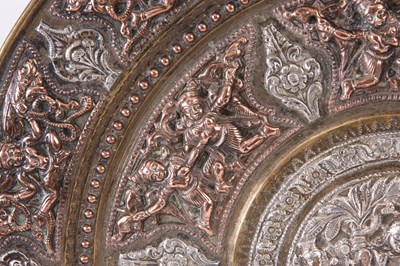 Lot 287 - A 19TH CENTURY INDIAN TANJORE SILVER AND COPPER OVERLAID BRASS CHARGER