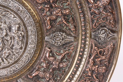 Lot 287 - A 19TH CENTURY INDIAN TANJORE SILVER AND COPPER OVERLAID BRASS CHARGER
