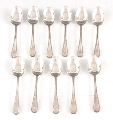 Lot 450 - A VICTORIAN SET OF ELEVEN SINGLE STRUCK BEAD EDGE TEASPOONS