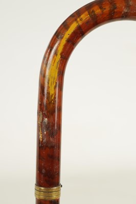 Lot 513 - A 20TH CENTURY SWORD STICK TOGETHER WITH A 20TH CENTURY SIMULATED TORTOISESHELL WALKING STICK WITH PULL OUT KOSH