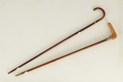 Lot 513 - A 20TH CENTURY SWORD STICK TOGETHER WITH A 20TH CENTURY SIMULATED TORTOISESHELL WALKING STICK WITH PULL OUT KOSH