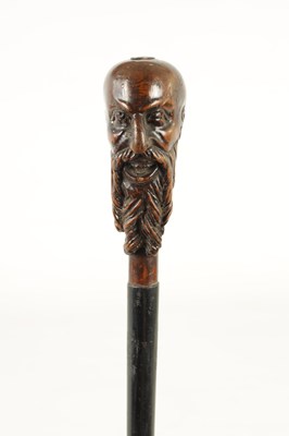 Lot 468 - AN EARLY 20TH CENTURY TREEN CARVED HARDWOOD WALKING STICK