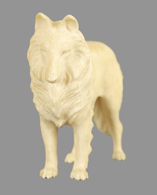 Lot 70 - A JAPANESE MEIJI PERIOD CARVED IVORY SCULPTURE OF A DOG