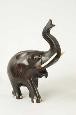 Lot 249 - A LATE 19TH CENTURY ANGLO INDIAN CARVED EBONY ELEPHANT
