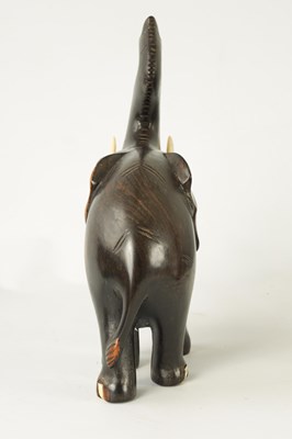 Lot 249 - A LATE 19TH CENTURY ANGLO INDIAN CARVED EBONY ELEPHANT