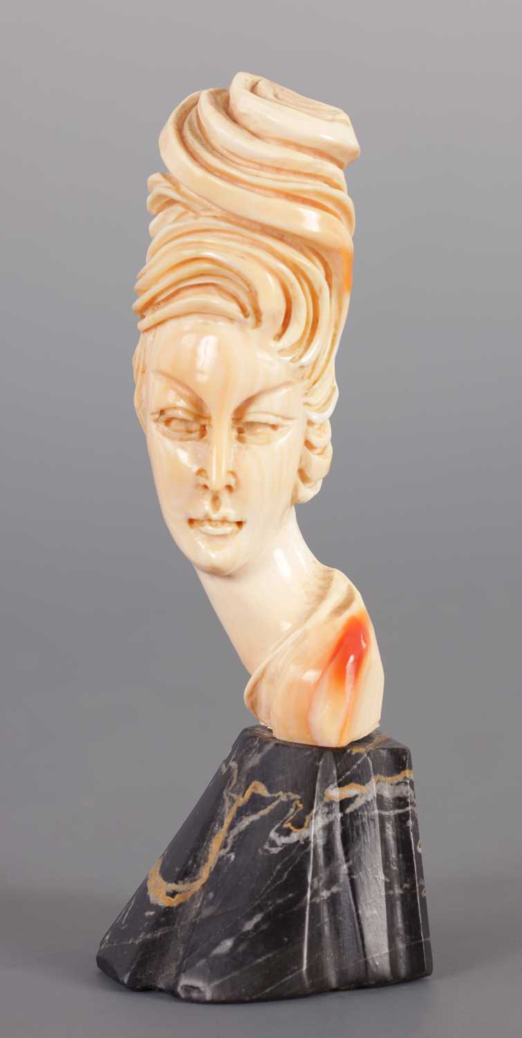 Lot 210 - AN ART NOUVEAU CARVED IVORY BUST OF A YOUNG LADY