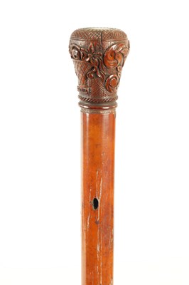 Lot 21 - A LATE 18TH CENTURY CARVED HANDLED MALACCA WALKING STICK