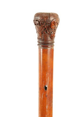 Lot 21 - A LATE 18TH CENTURY CARVED HANDLED MALACCA WALKING STICK