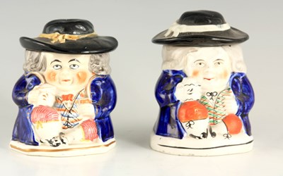 Lot 25 - A PAIR OF COLOURFUL SEATED TOBY FIGURE LIDDED JARS