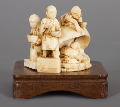 Lot 268 - A JAPANESE MEIJI PERIOD IVORY NETSUKE ON STAND