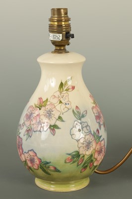 Lot 140 - A PAIR OF MOORCROFT LAMPS IN THE SPRING BLOSSOM DESIGN
