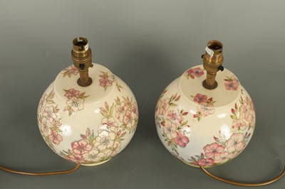 Lot 102 - A PAIR OF MOORCROFT LAMPS IN THE SPRING BLOSSOM DESIGN