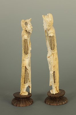 Lot 144 - A PAIR OF JAPANESE MEIJI PERIOD IVORY OKIMONO ON WOODEN BASES
