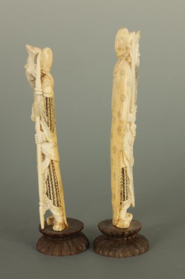 Lot 144 - A PAIR OF JAPANESE MEIJI PERIOD IVORY OKIMONO ON WOODEN BASES