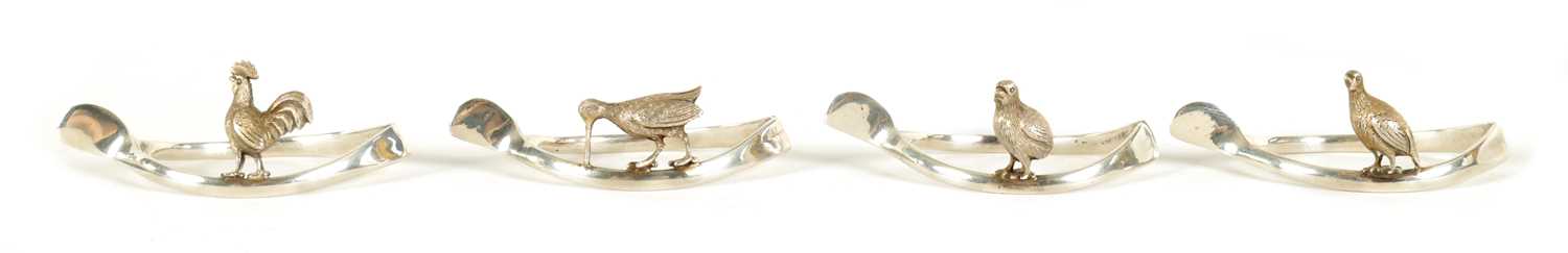Lot 318 - OF COUNTRY SPORTS INTEREST - A SET OF FOUR EARLY 20TH CENTURY SILVER NAPKIN HOLDERS