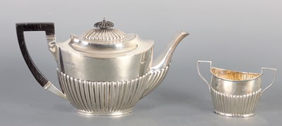 Lot 434 - A LATE 19TH CENTURY SILVER TEAPOT AND SUGAR BOWL