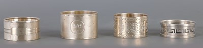 Lot 440 - A COLLECTION OF FOUR SILVER NAPKIN RINGS