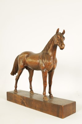 Lot 561 - A LATE 19TH CENTURY SWISS CARVED WOOD EQUESTRIAN SCULPTURE