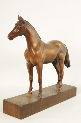 Lot 561 - A LATE 19TH CENTURY SWISS CARVED WOOD EQUESTRIAN SCULPTURE