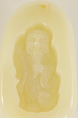 Lot 70 - A CHINESE CARVED JADE BOULDER DEPICTING A SAGE HOLDING A STAFF