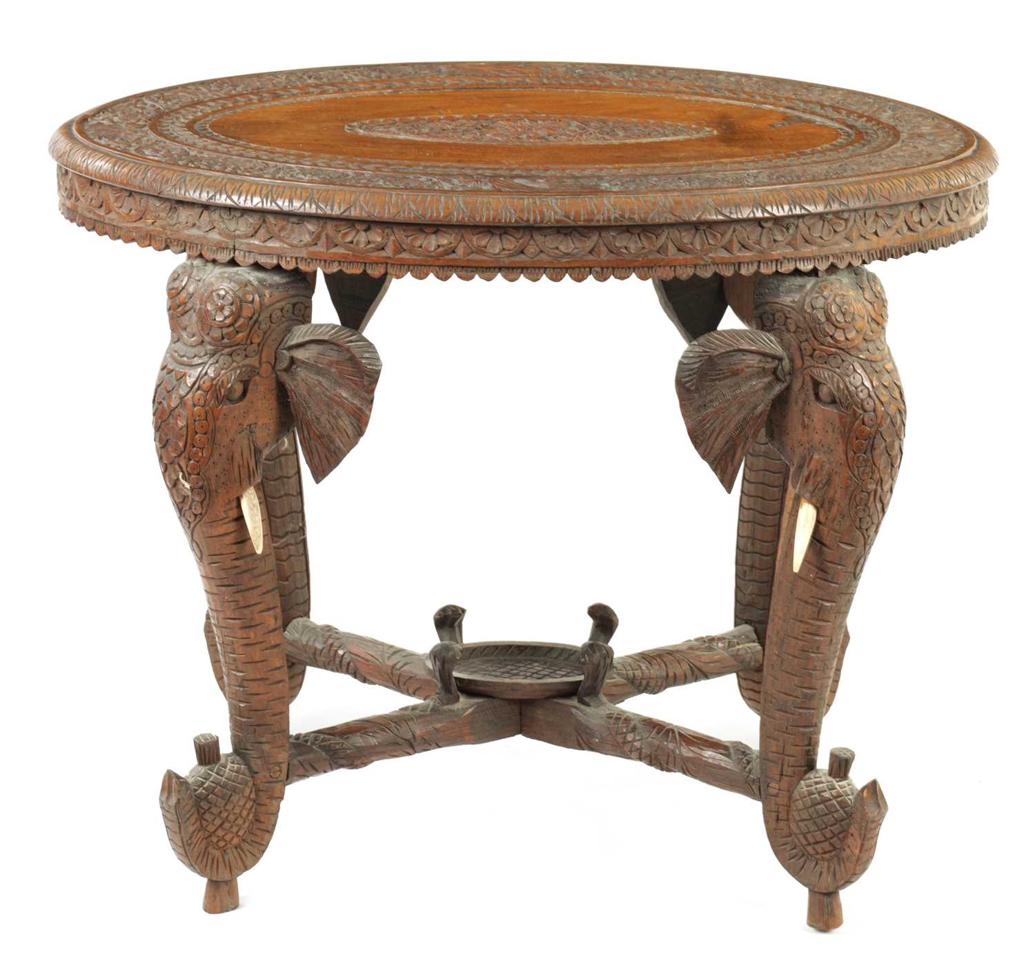 Lot 250 - A LATE 19TH CENTURY CARVED INDIAN ELEPHANT TABLE