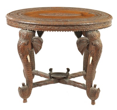 Lot 250 - A LATE 19TH CENTURY CARVED INDIAN ELEPHANT TABLE