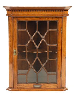 Lot 975 - A 20TH CENTURY OAK GLAZED CORNER CUPBOARD