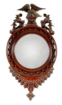 Lot 1025 - A 19TH CENTURY MAHOGANY CONVEX HANGING MIRROR