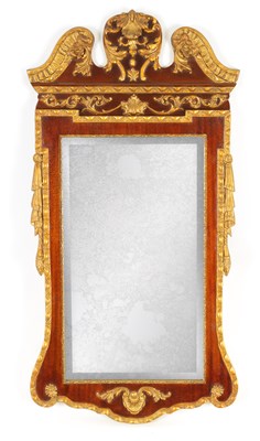 Lot 1016 - A GEORGIAN STYLE MAHOGANY AND GILT HANGING MIRROR