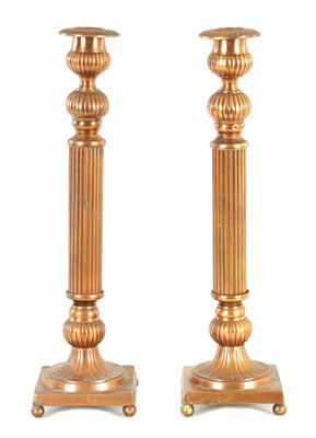 Lot 539 - A PAIR OF PRESSED COPPER CANDLESTICKS