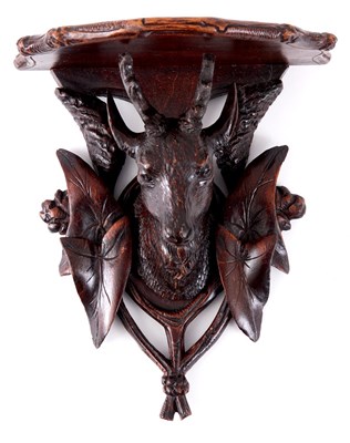 Lot 663 - A 19TH CENTURY BLACK FOREST WALL BRACKET with...