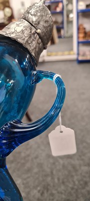 Lot 125 - A 19TH CENTURY BLUE GLASS CLARET JUG IN THE FORM OF AN OWL