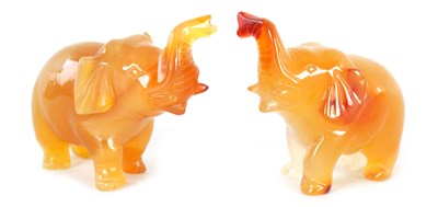 Lot 664 - A PAIR OF CARVED RUSSET JADE ELEPHANTS