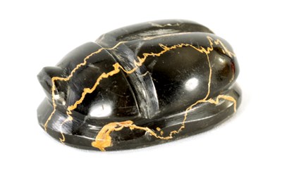 Lot 578 - A BLACK VARIEGATED MODEL OF A SCARAB BEETLE