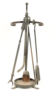 Lot 546 - A 20TH CENTURY WROUGHT IRON FIRE TIDY