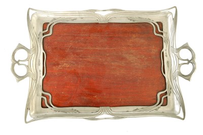 Lot 603 - AN ART NOUVEAU PEWTER AND MAHOGANY TRAY