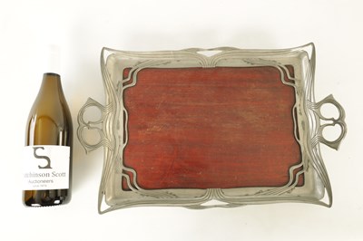 Lot 603 - AN ART NOUVEAU PEWTER AND MAHOGANY TRAY