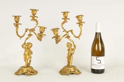 Lot 452 - A PAIR OF 19TH CENTURY ORMOLU FIGURAL THREE BRANCH CANDELABRA