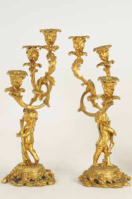 Lot 452 - A PAIR OF 19TH CENTURY ORMOLU FIGURAL THREE BRANCH CANDELABRA
