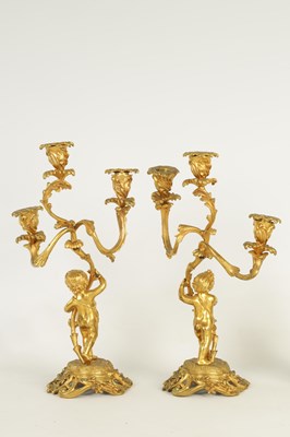 Lot 452 - A PAIR OF 19TH CENTURY ORMOLU FIGURAL THREE BRANCH CANDELABRA