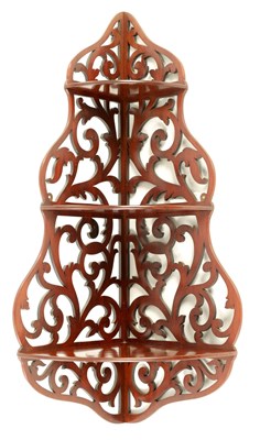 Lot 997 - A 19TH CENTURY MAHOGANY PIERCED CORNER WHATNOT