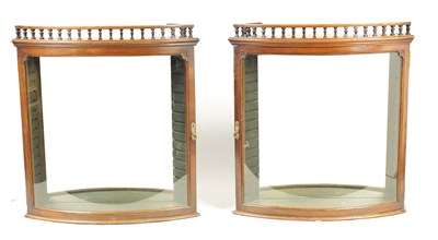 Lot 996 - A PAIR OF 19TH CENTURY MAHOGANY BOW FRONTED DISPLAY CABINETS