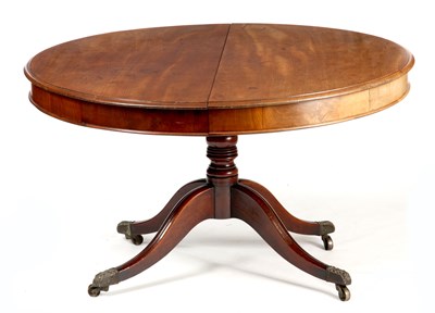 Lot 954 - A GEORGE III FIGURED MAHOGANY CIRCULAR PULL-OUT DINING TABLE