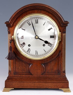 Lot 622 - AN EDWARDIAN DOME TOP OAK MANTEL CLOCK with...